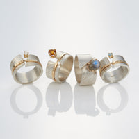 shown with the artist's between you and me rings