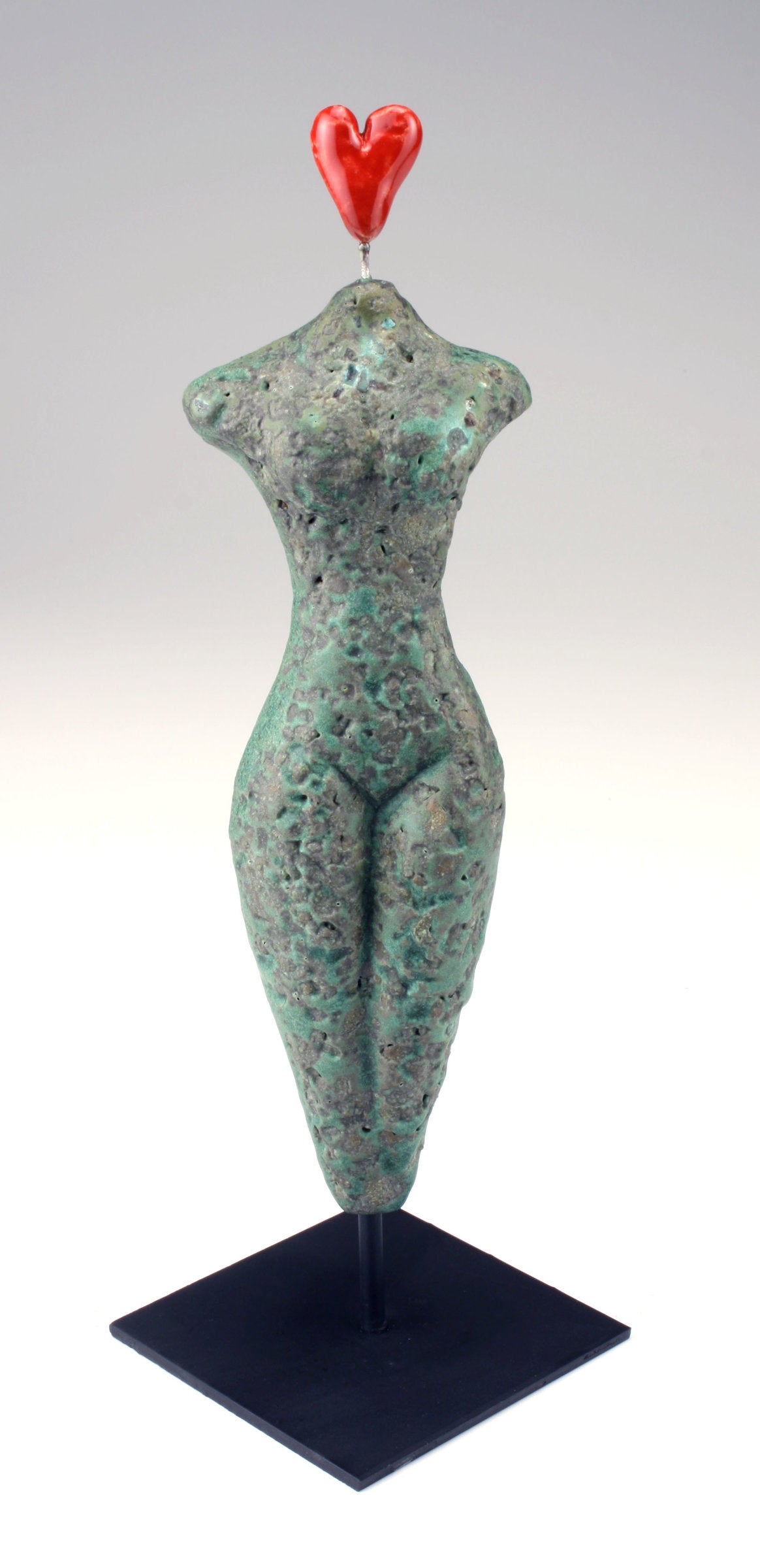 Figure on stand, Exuberant Heart