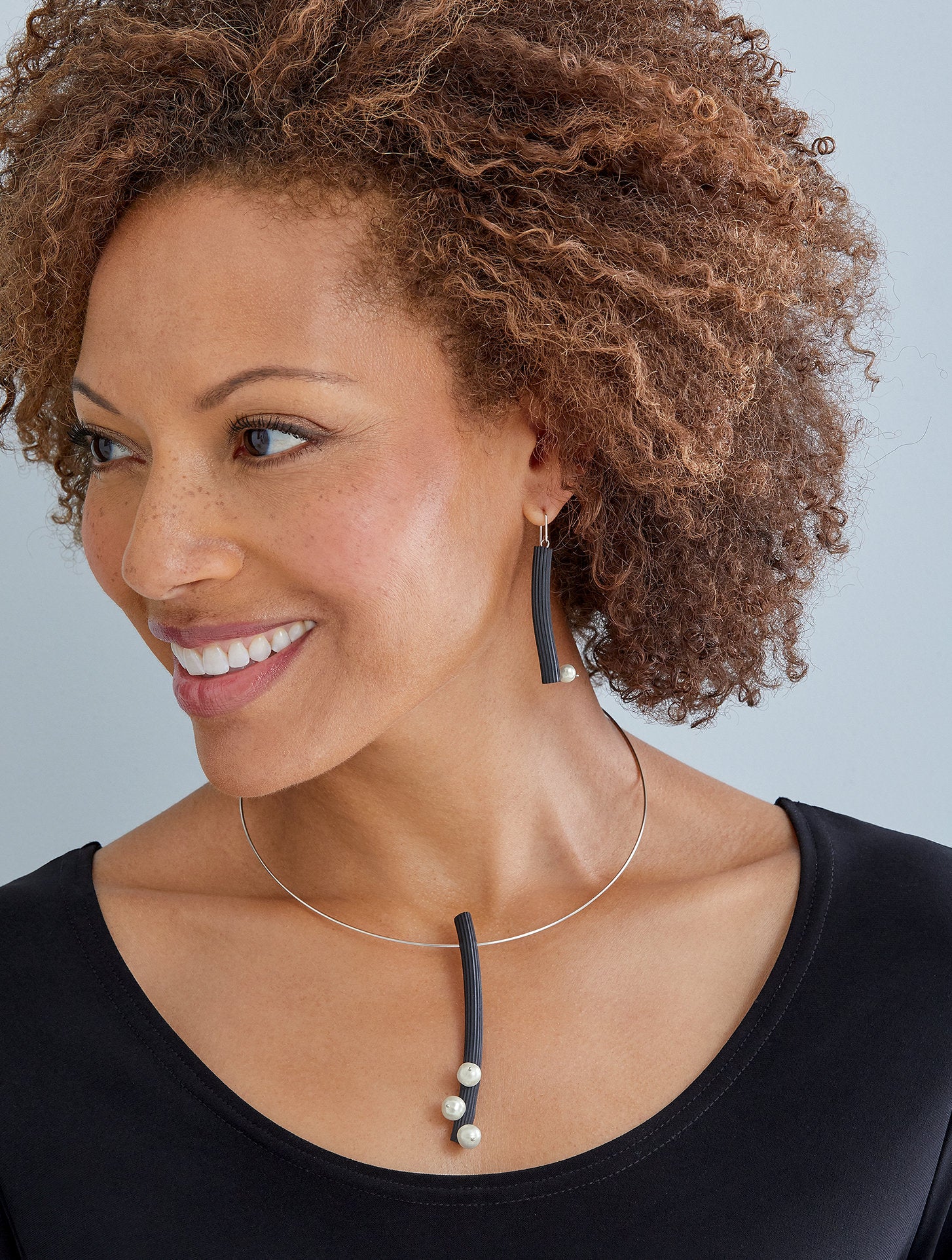 Shown with the studded with pearls earrings