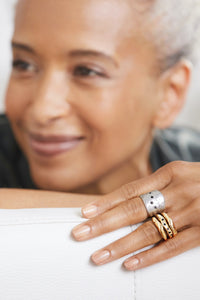 shown with the artist's Bronze Stacking Rings with Black Diamonds