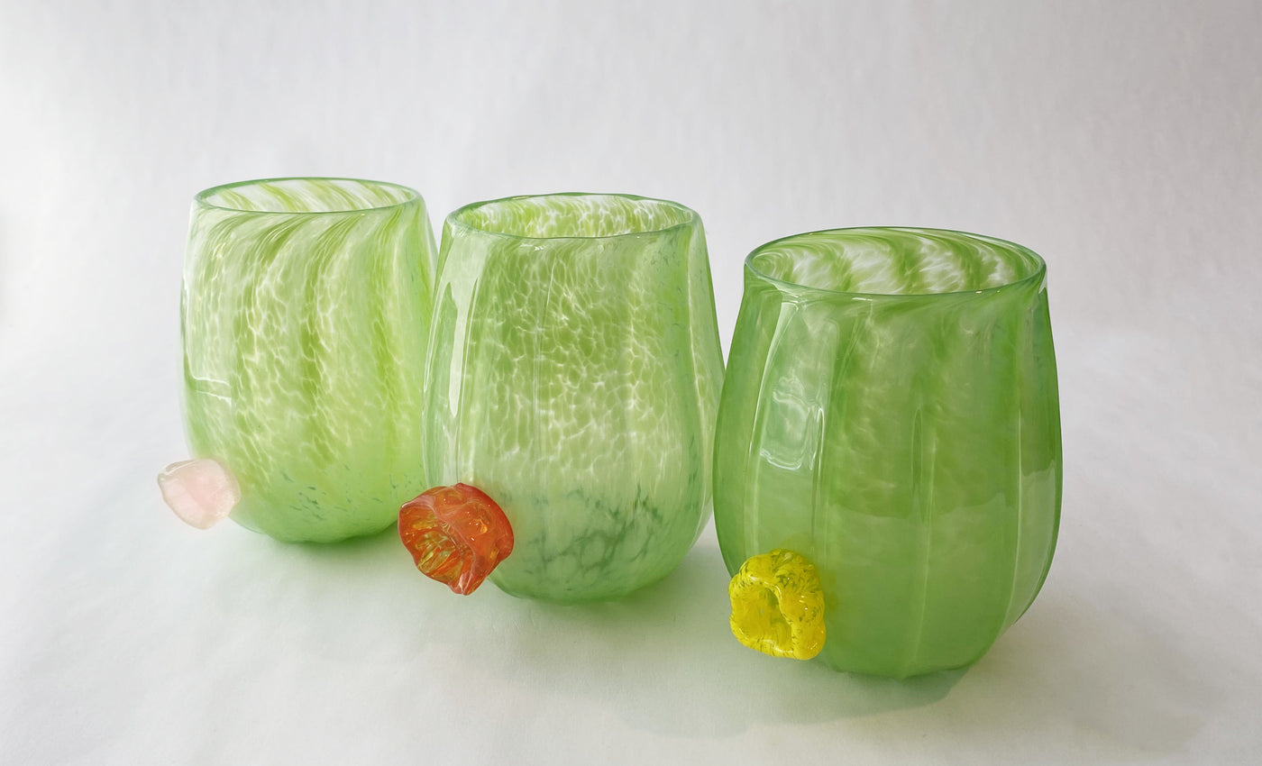 left to right: pink flower, orange flower, yellow flower