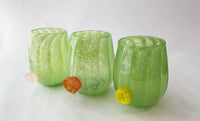 left to right: pink flower, orange flower, yellow flower