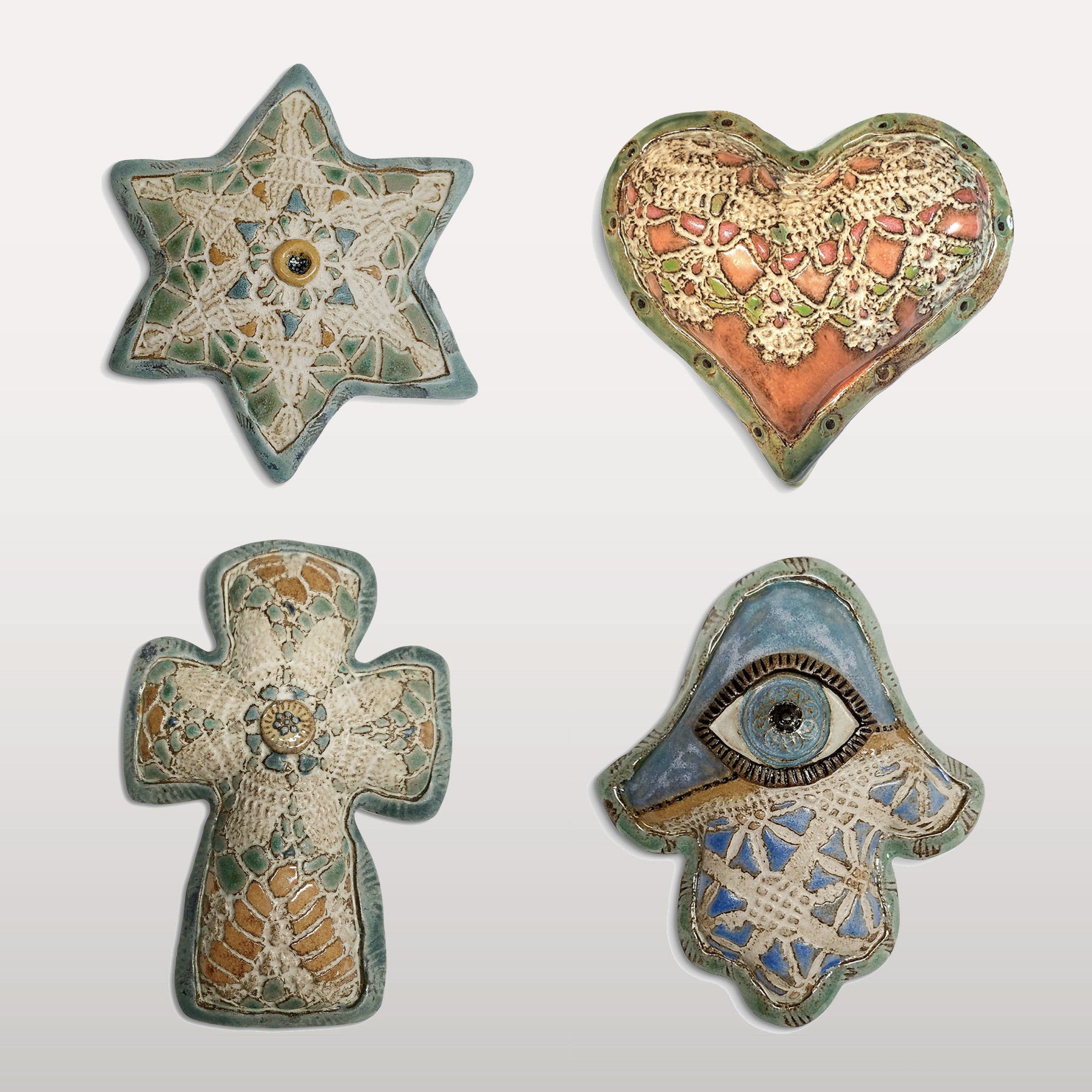 top left to right: star of david, sweet heart; bottom left to right: madonna lily cross, butter blue hamsa