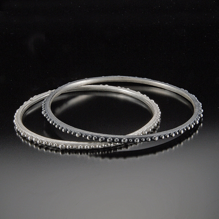 Oxidized Silver on Top, Bright Silver underneath