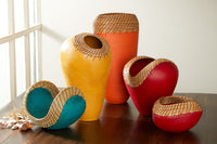 left to right: small boat in teal, ochre nest, oval vessel in orange, medium red heart, triangle bowl in red