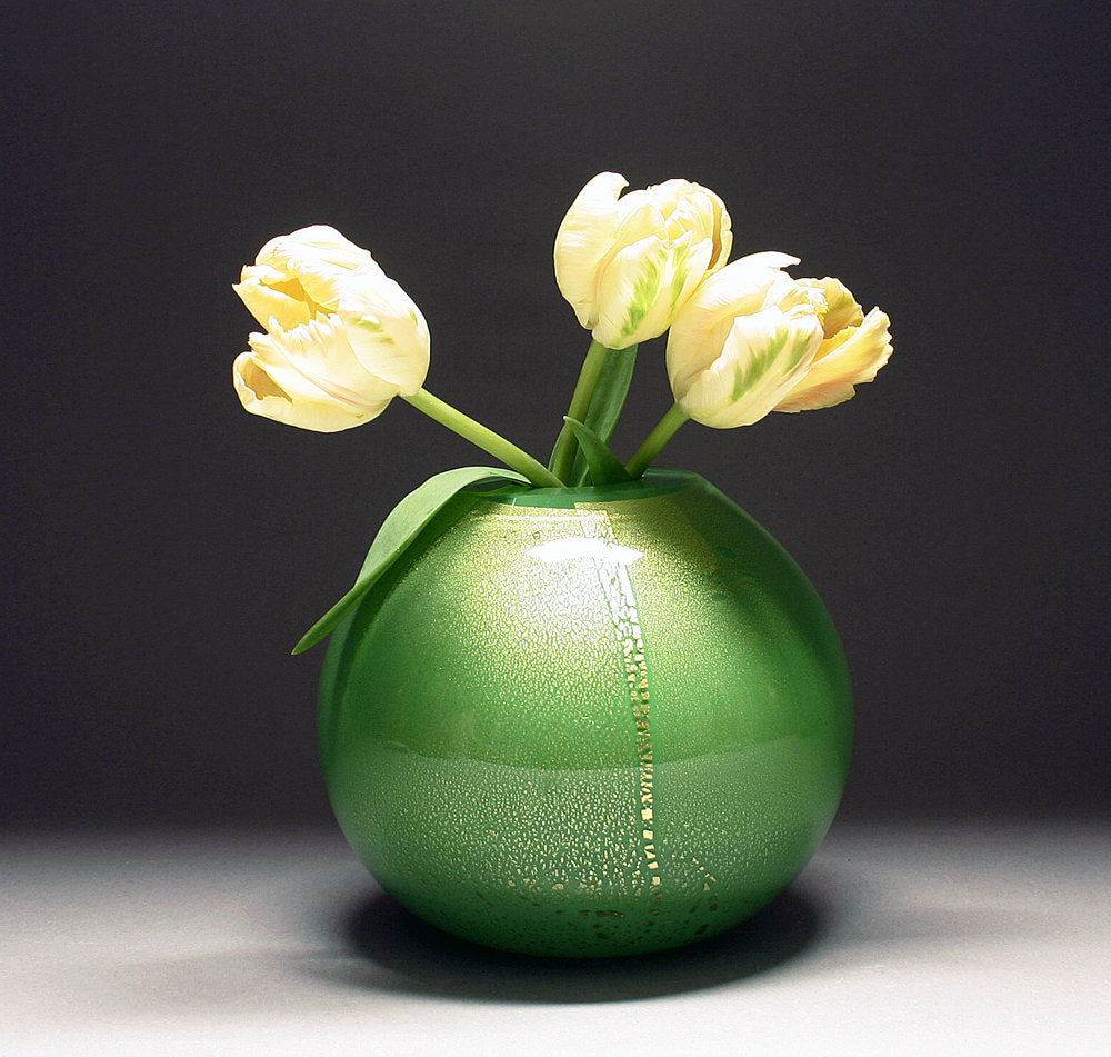 gold vase in green