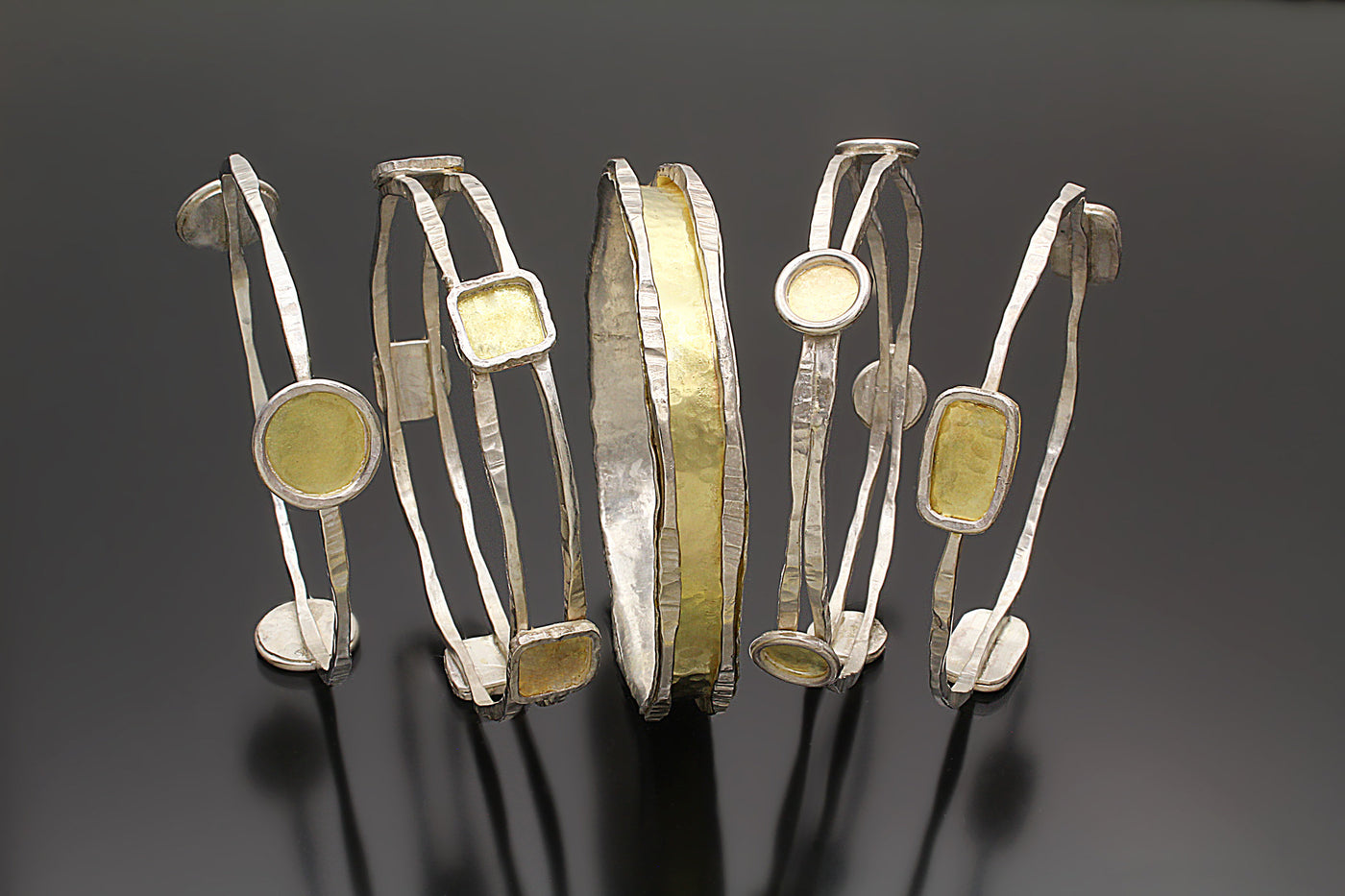 shown from left to right: large circles, squares, charming bangle, small circles, and rectangles