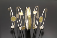 shown from left to right: large circles, squares, charming bangle, small circles, and rectangles