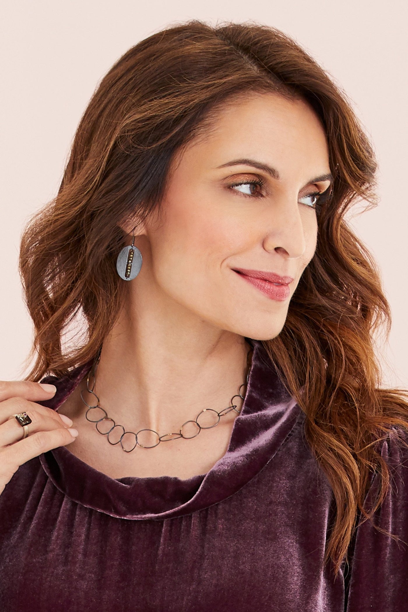 necklace shown with carved oval segment earrings by heather guidero