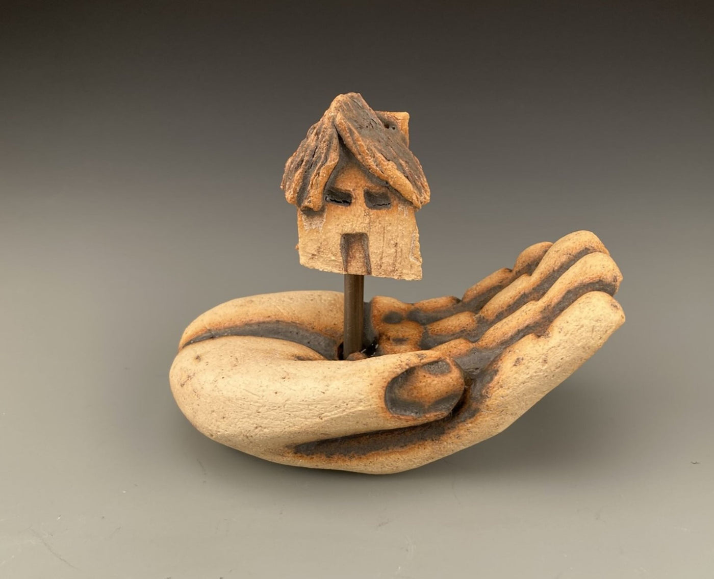 Hand with House