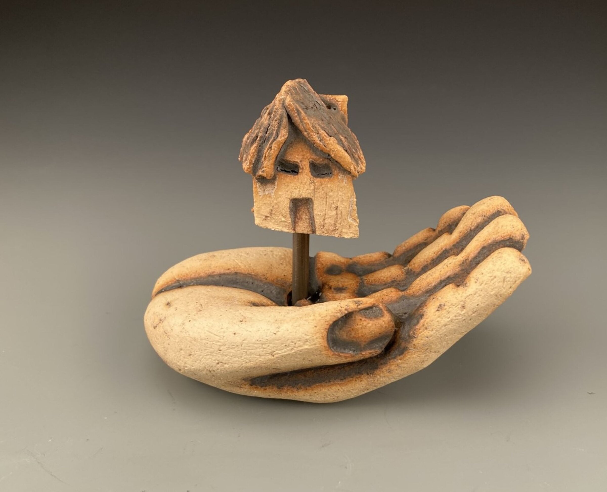 Hand with House