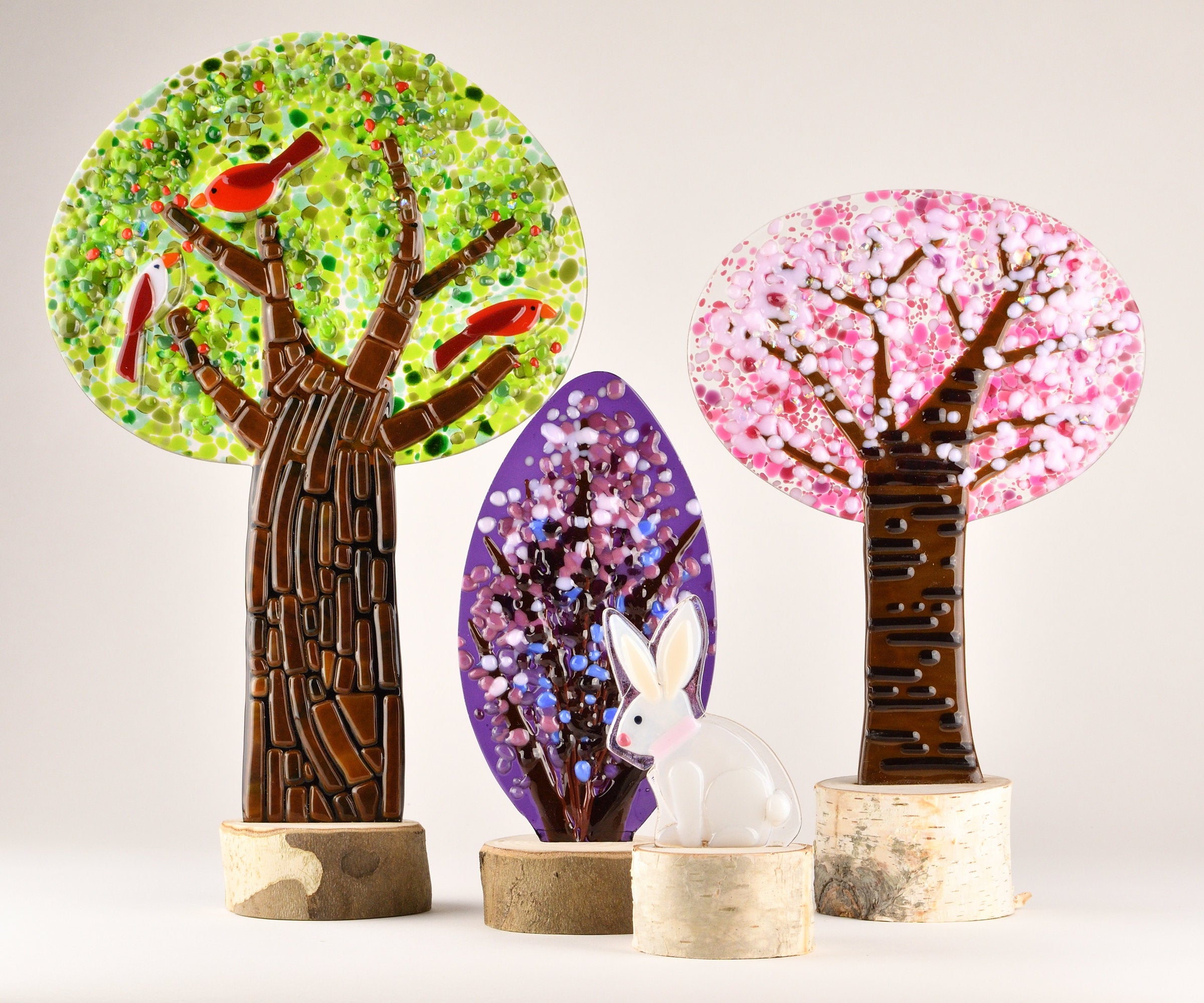 left to right: birdberry tree, faberge bush, honey bunny, blush blossom tree