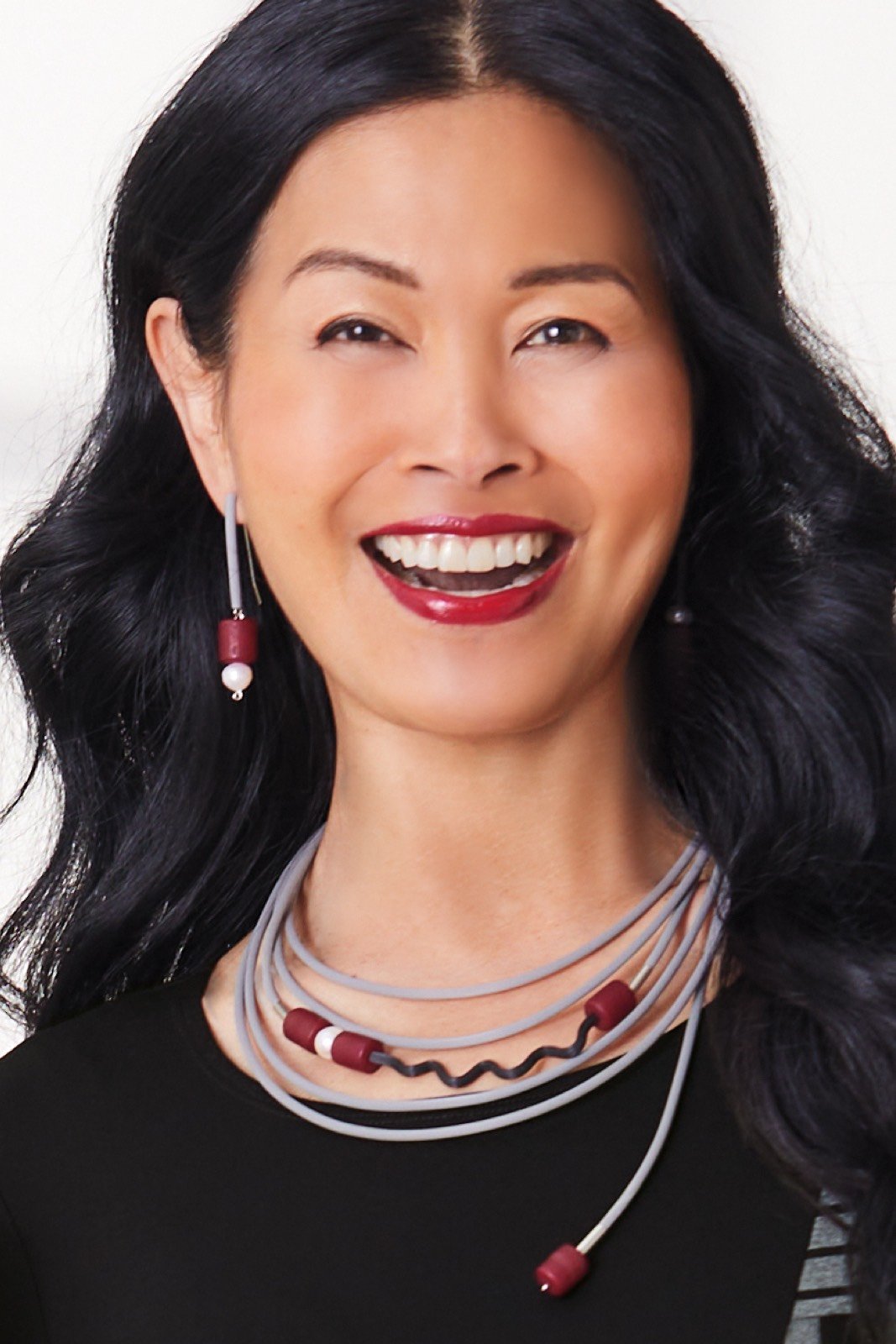 shown with the touch of red earrings