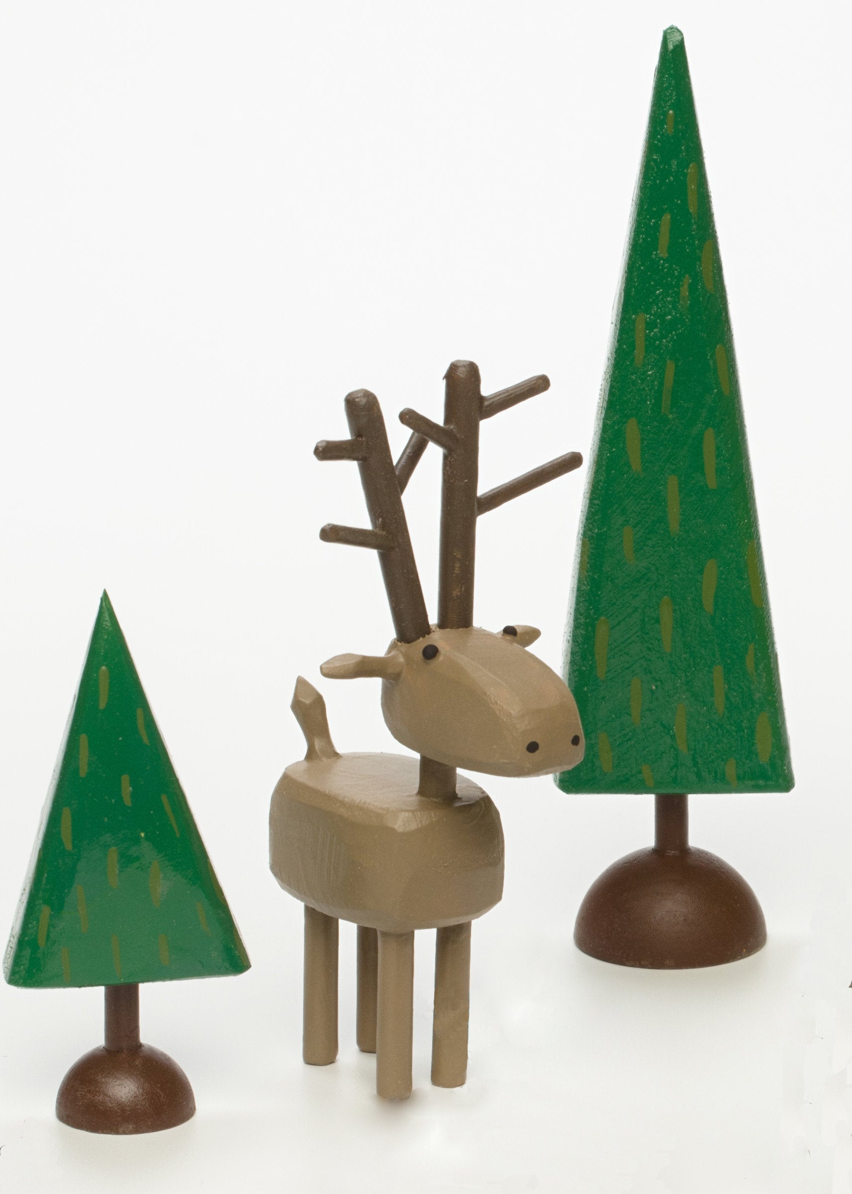 deer figure, shown with two dark trees