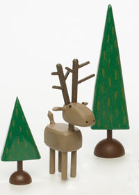 deer figure, shown with two dark trees