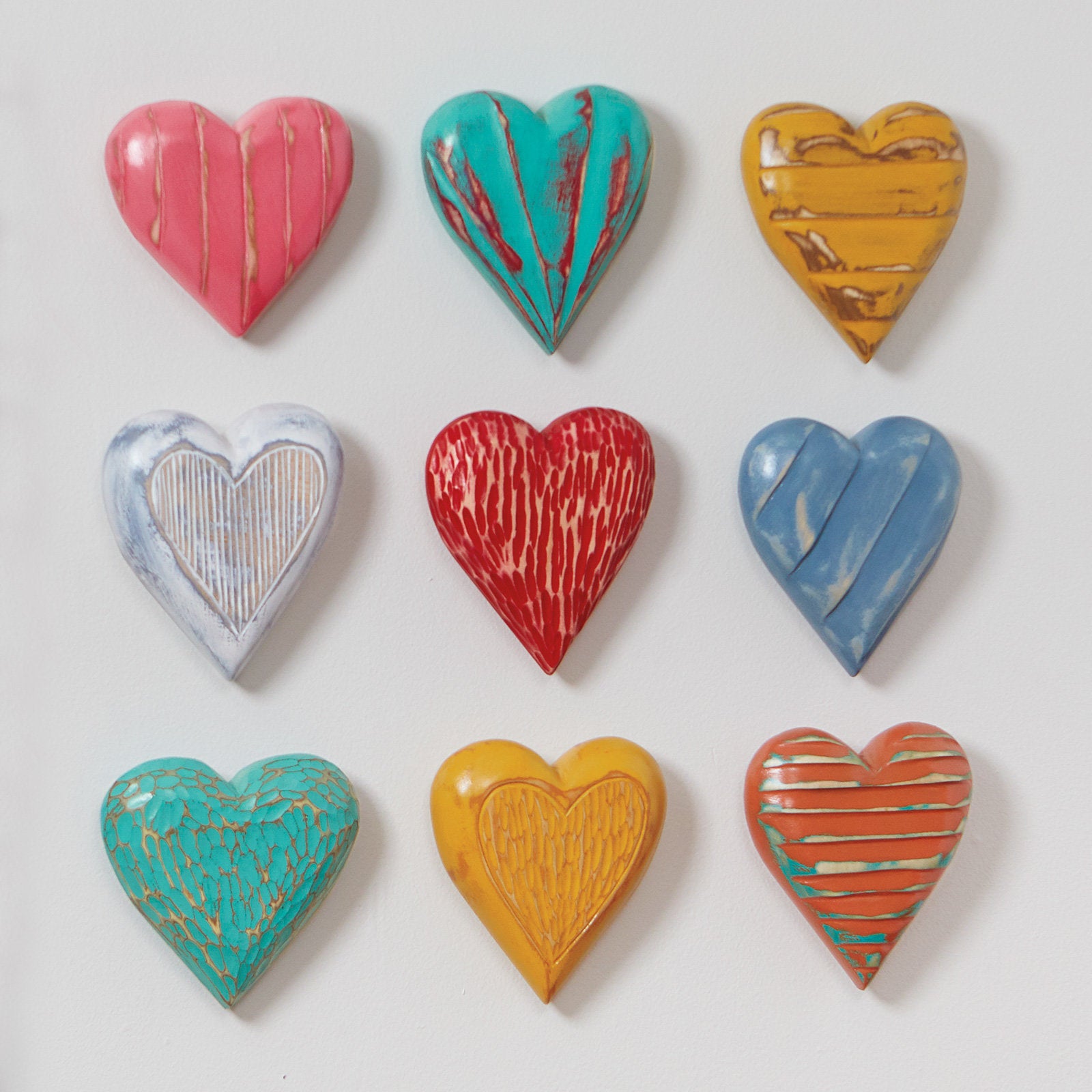top to bottom, left to right: coral vertical, turquoise radial, marigold horizontal, white outline, red groove, blue diagonal, turquoise pebble, marigold outline, orange horizontal