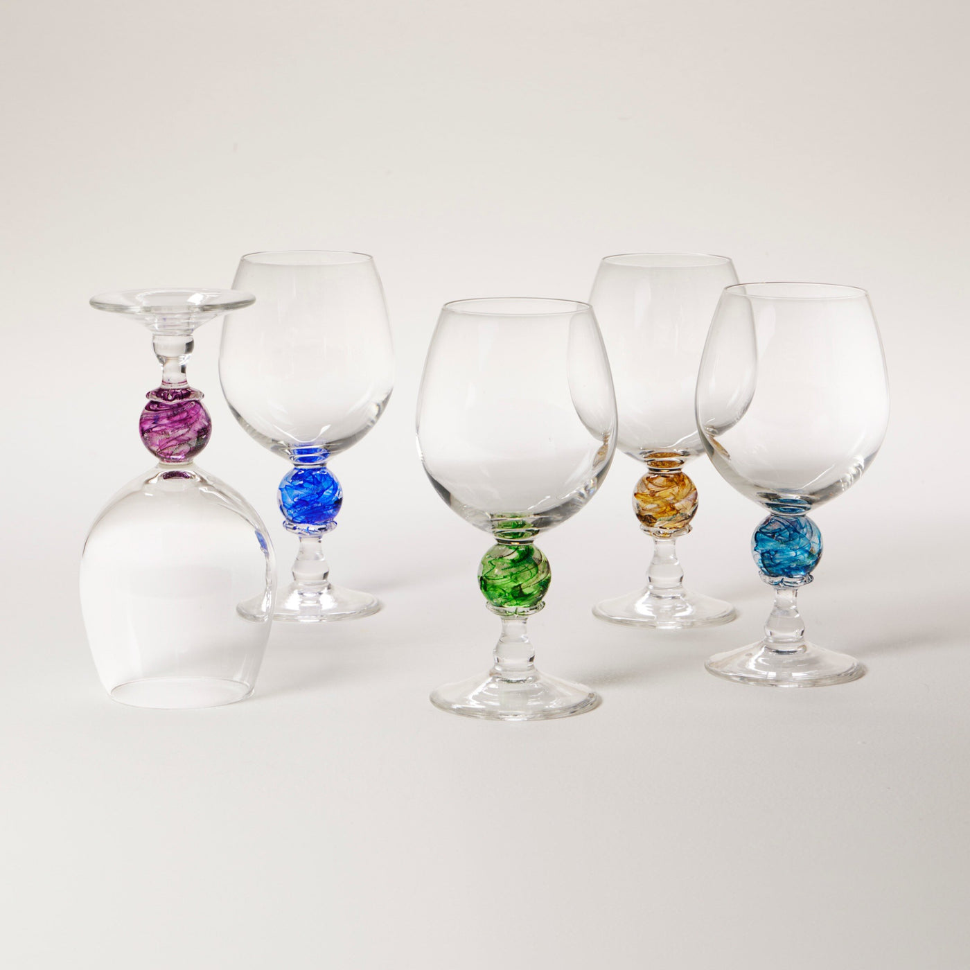 left to right: amethyst, cobalt, emerald, gold, turquoise