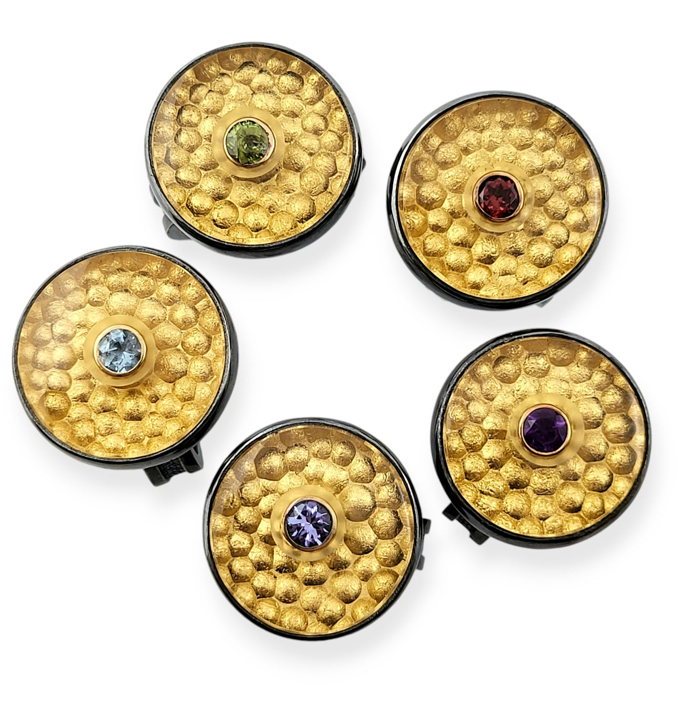 clockwise: peridot, garnet, amethyst, tanzanite, aquamarine