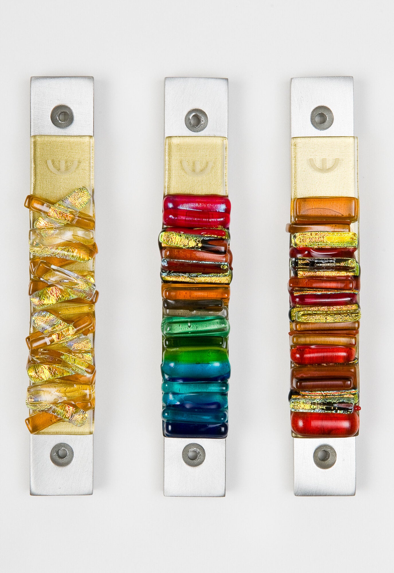 left to right: woven golden sun, rainbow, sunset