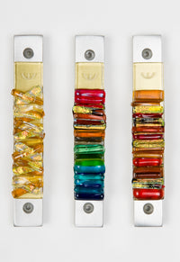 left to right: woven golden sun, rainbow, sunset