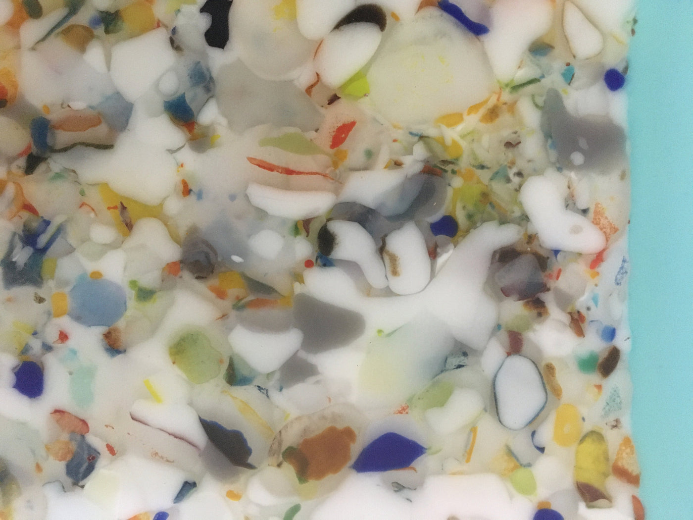 Three Confetti Plates on Blue