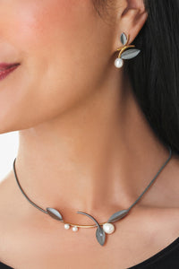 oxidized silver and gold, shown with the artist's coordinating alternating leaf necklace with white pearls