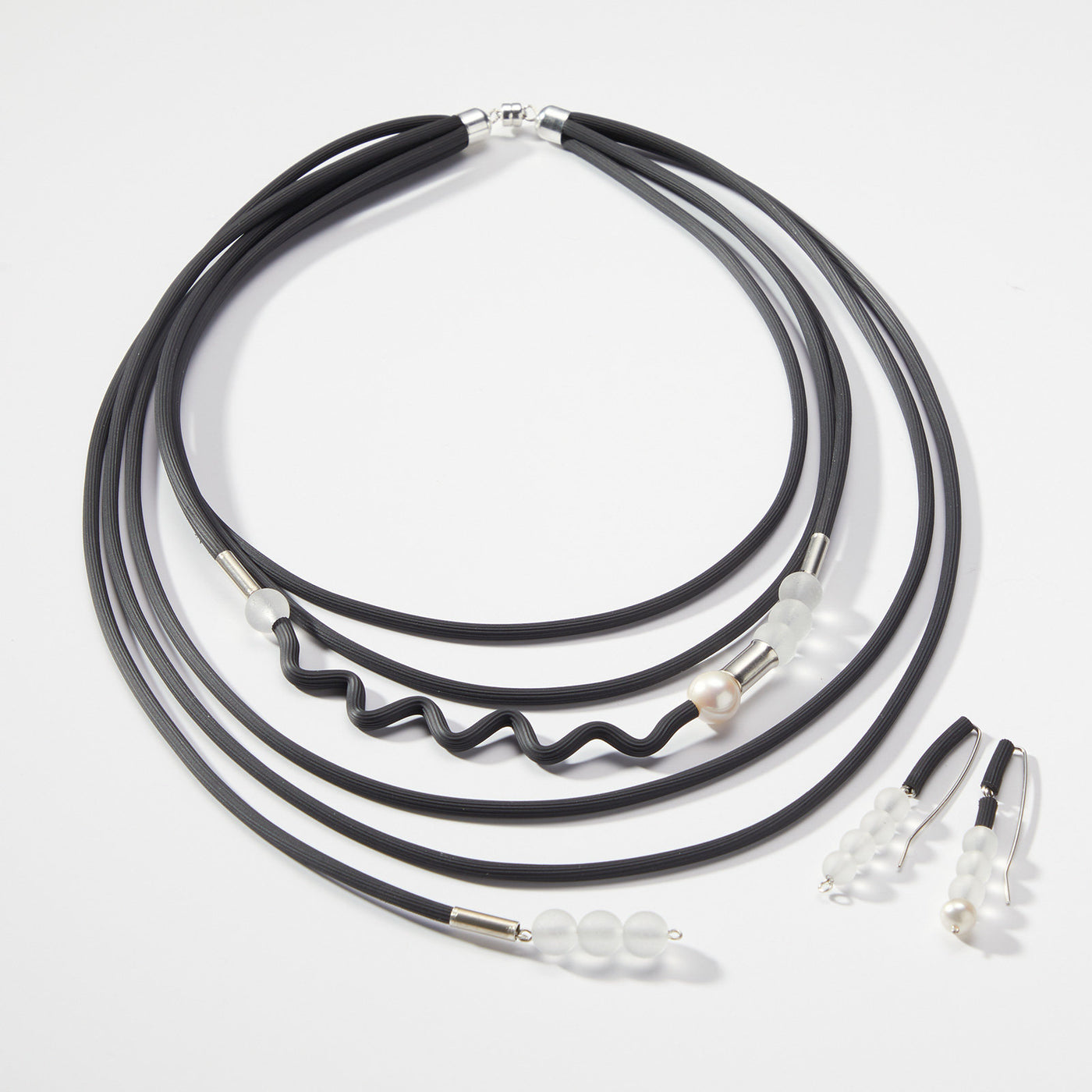 shown with the drops of glass necklace
