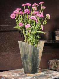 Small black Samara vase with purple flowers