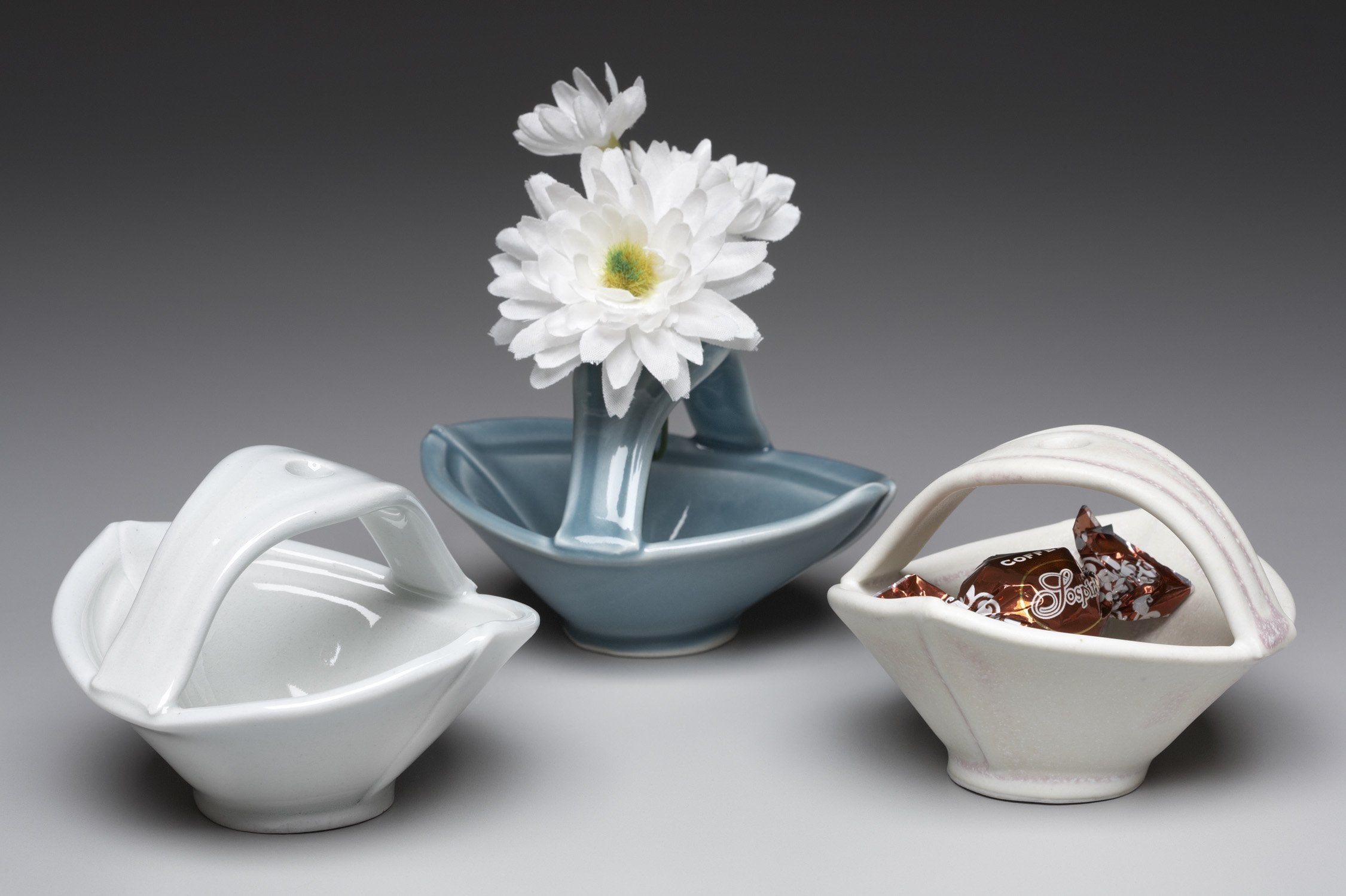 left to right: white with glossy finish, turquoise, white with matte finish