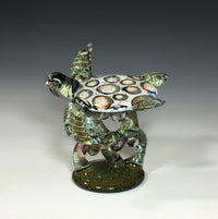 White Barnacle Turtle on Green Coral