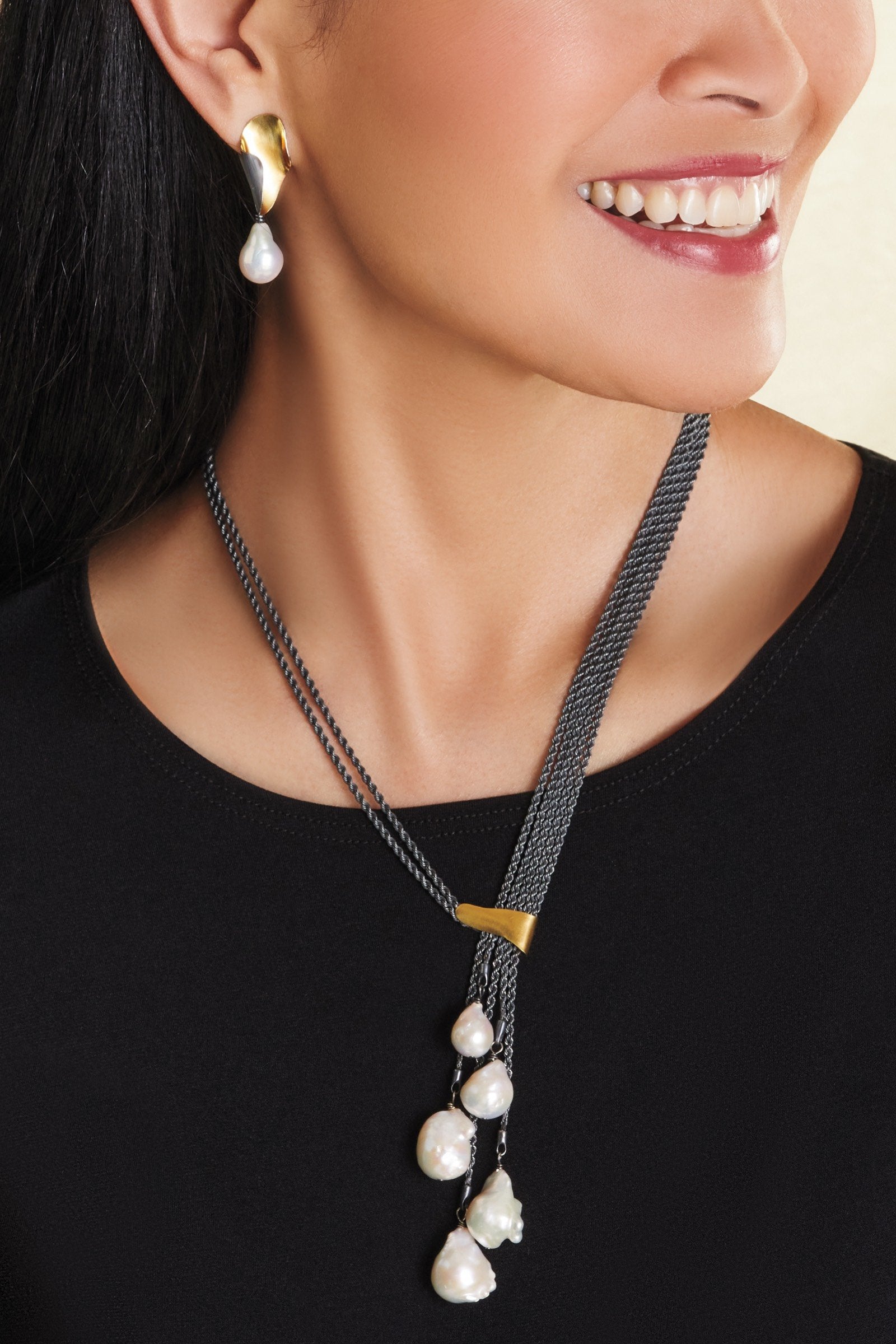 shown with the artist's harmony earrings