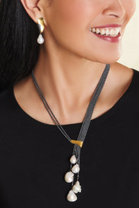 shown with the artist's harmony earrings