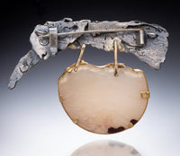 Showing back as a brooch