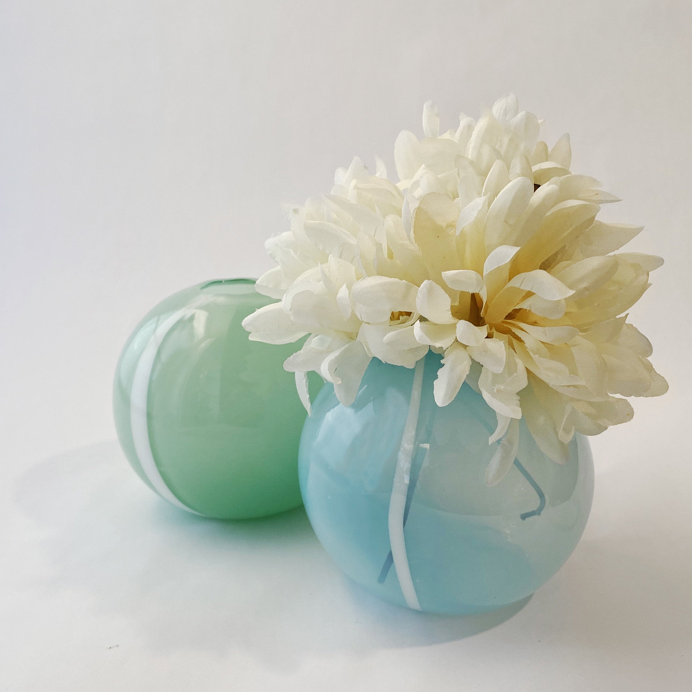 left to right: Mint Green, Opal Blue