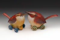 left to right: blue wheels, green wheels
