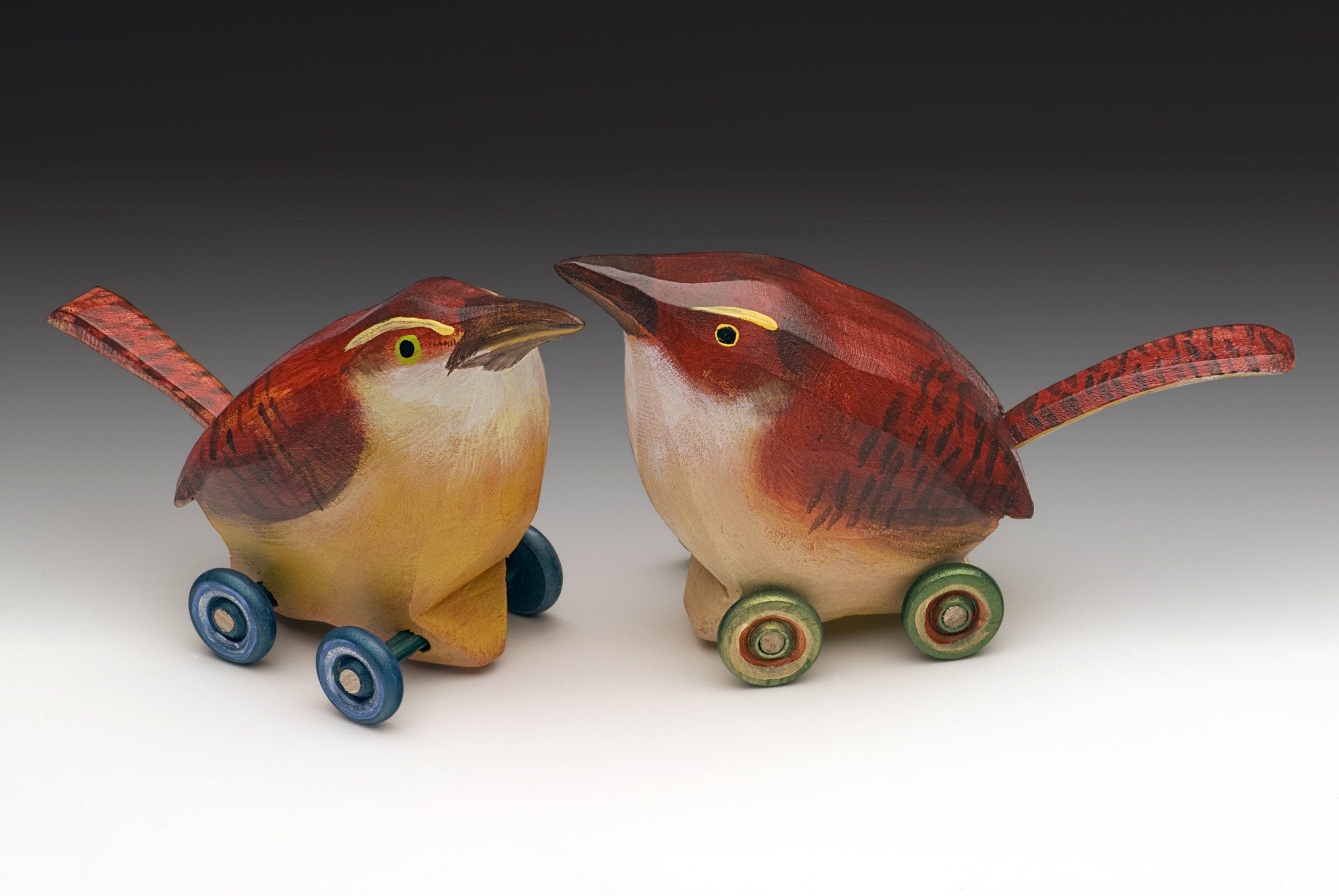 left to right: blue wheels, green wheels