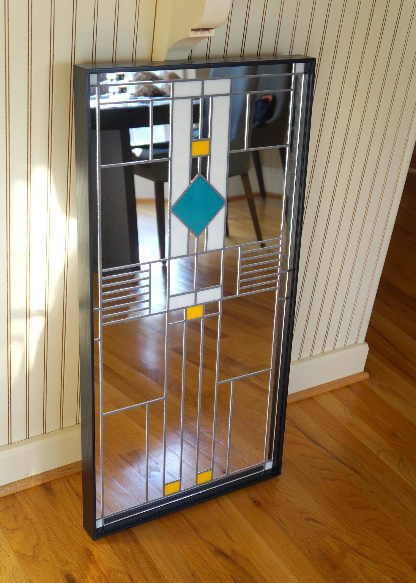 Art Deco mirror with blue, yellow, and white stained glass