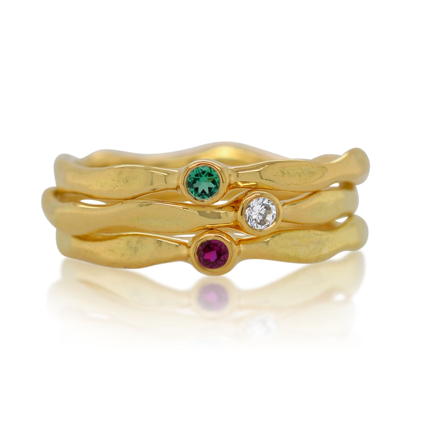 Top to Bottom: Lab-grown emerald, Lab-grown Diamond, Lab-grown Diamond