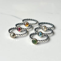 Clockwise: Citrine, Labradorite, Blue Topaz, Serpentine, Pyrite, Garnet