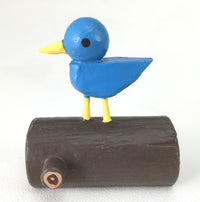 bird on log figure