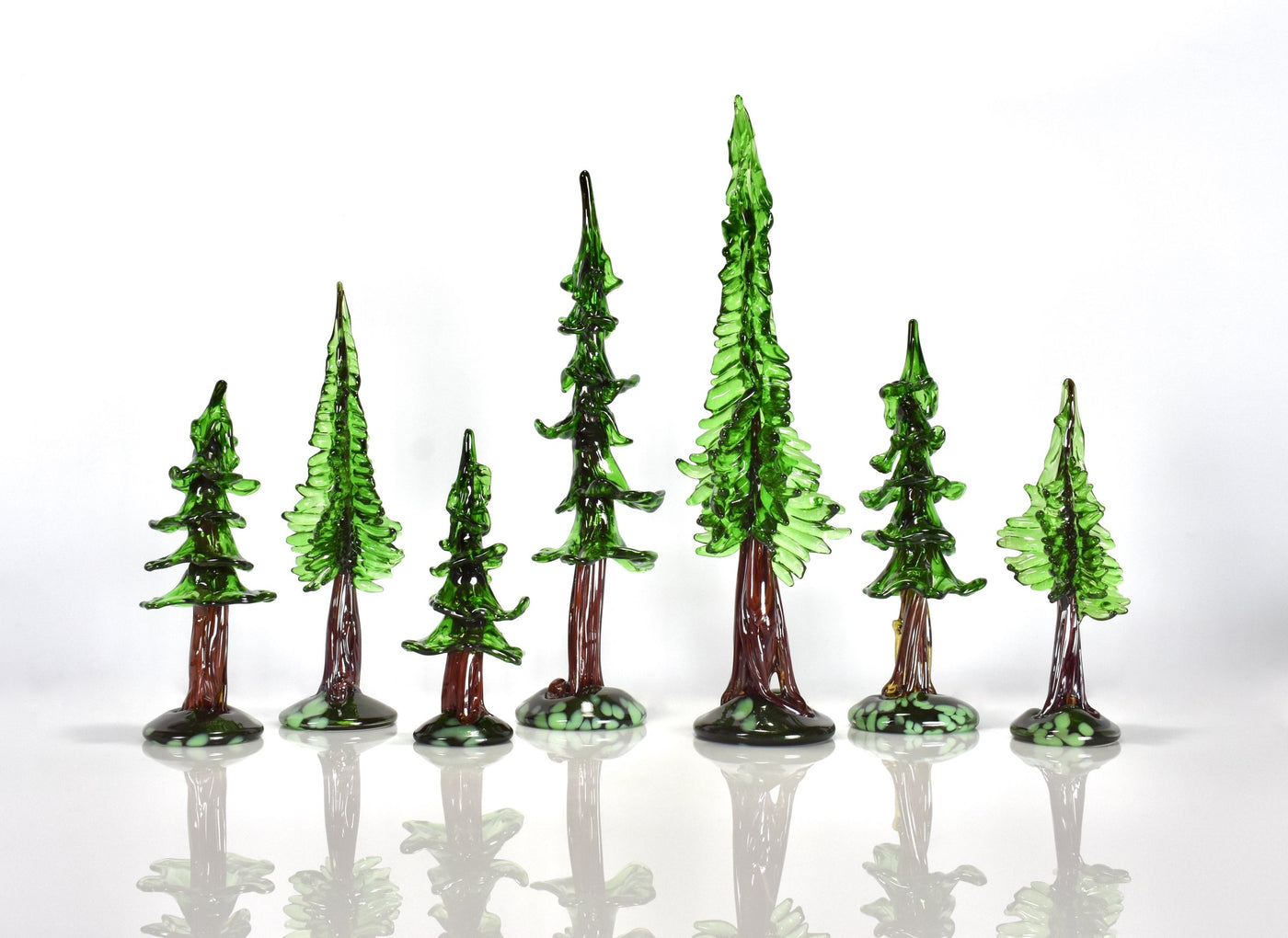 left to right: medium sequoia, medium redwood, small sequoia, large sequoia, large redwood, medium sequoia, small redwood