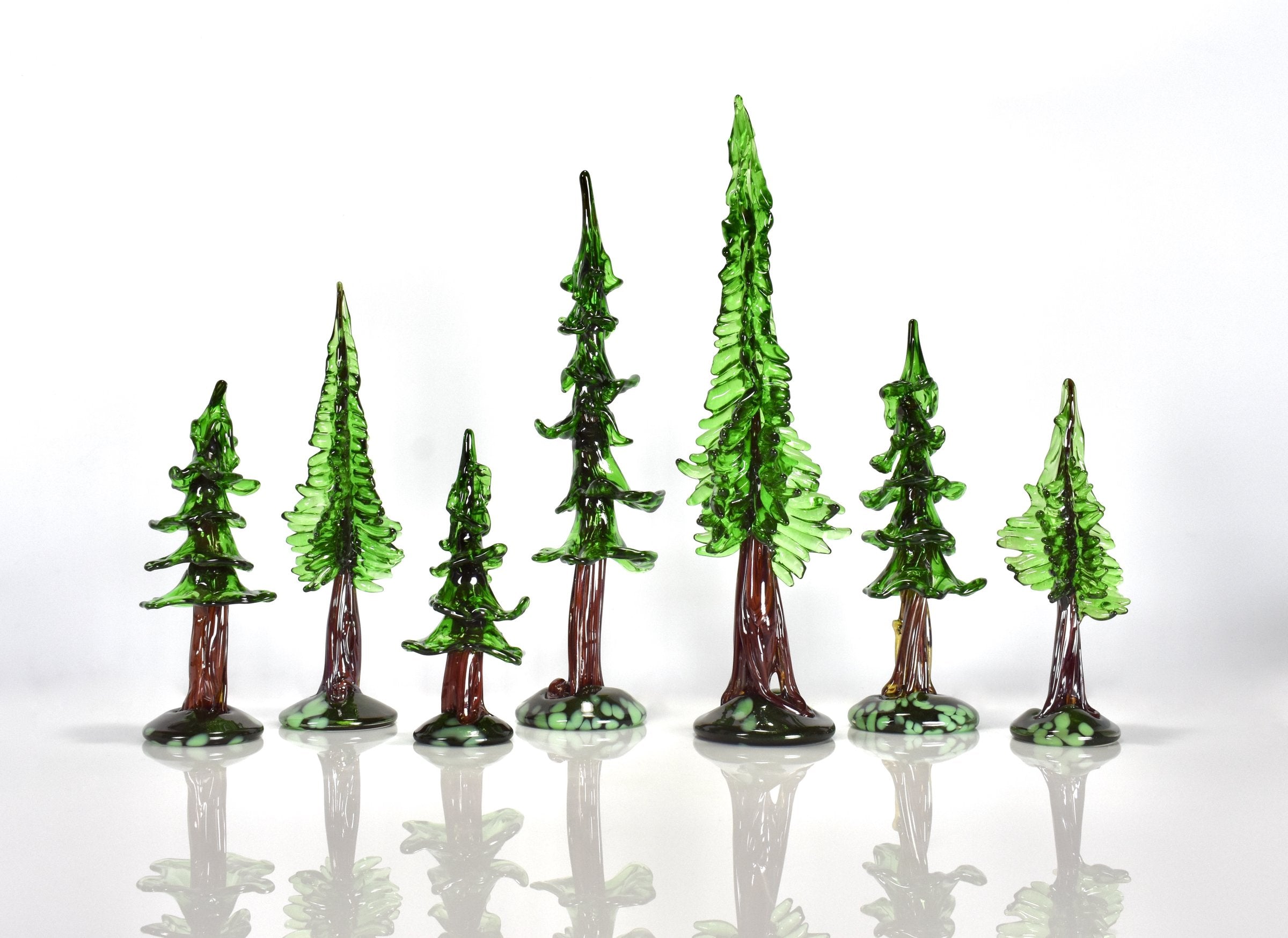 left to right: medium sequoia, medium redwood, small sequoia, large sequoia, large redwood, medium sequoia, small redwood