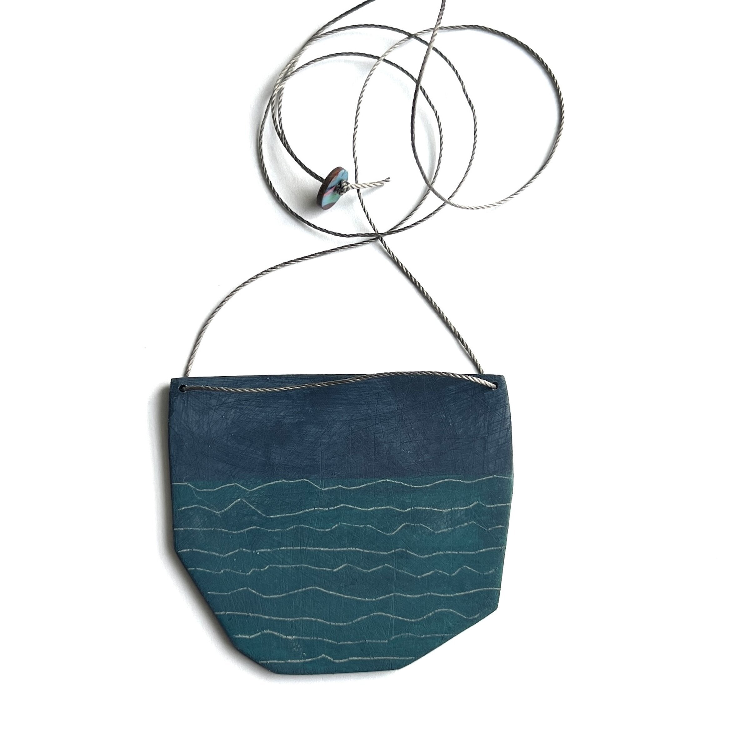 Oceanic Token Pendant