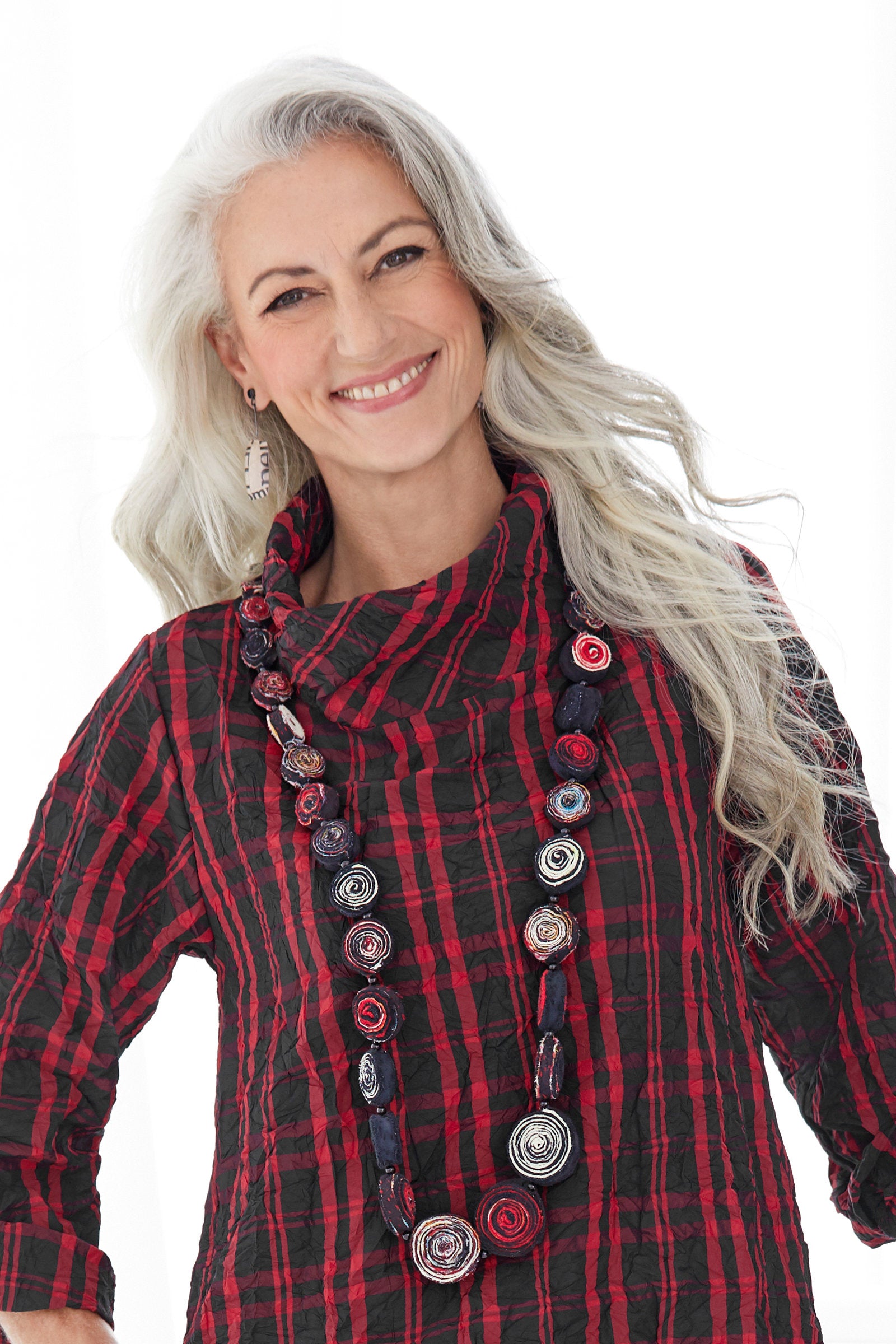 shown with the two-tone earrings by eliana arenas