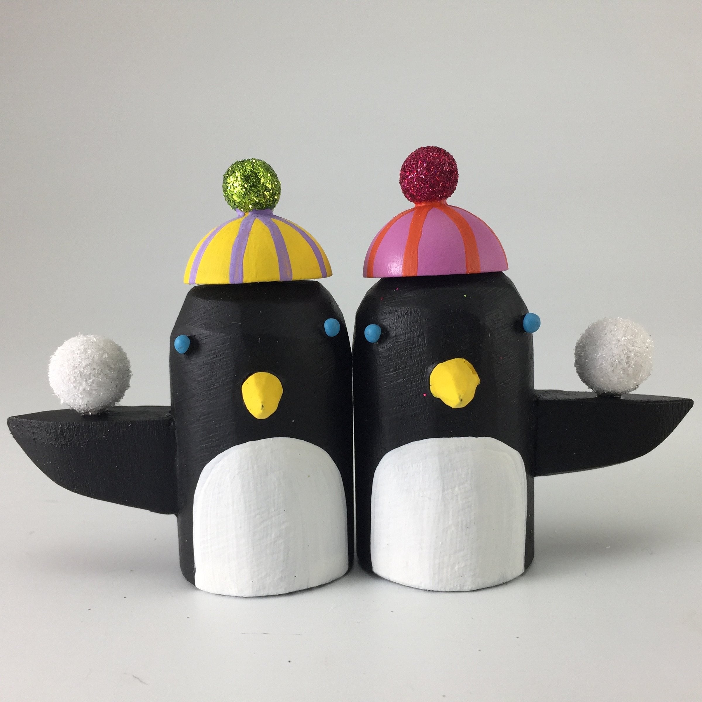 left to right: yellow hat, pink hat