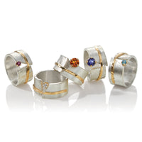 left to right: ruby, diamond, citrine, iolite, blue topaz