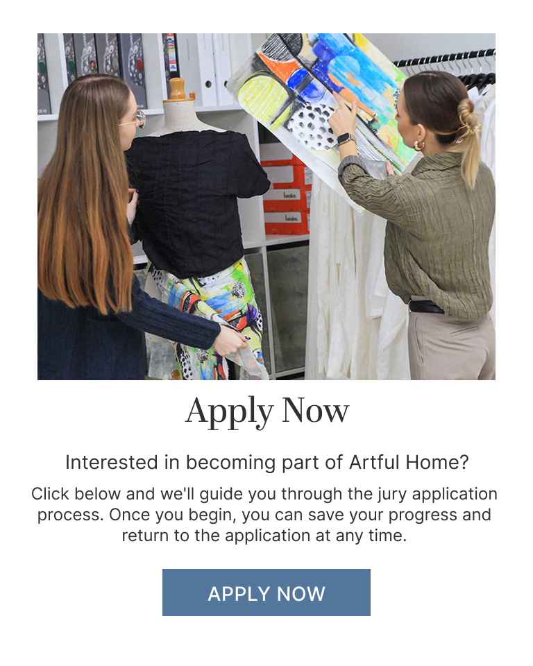 Two women looking at artistic fabric with text inviting them to apply to become part of Artful Home.