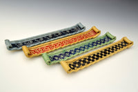 left to right: blue with black accent, honey with red accent, green with blue accent, honey with black accent