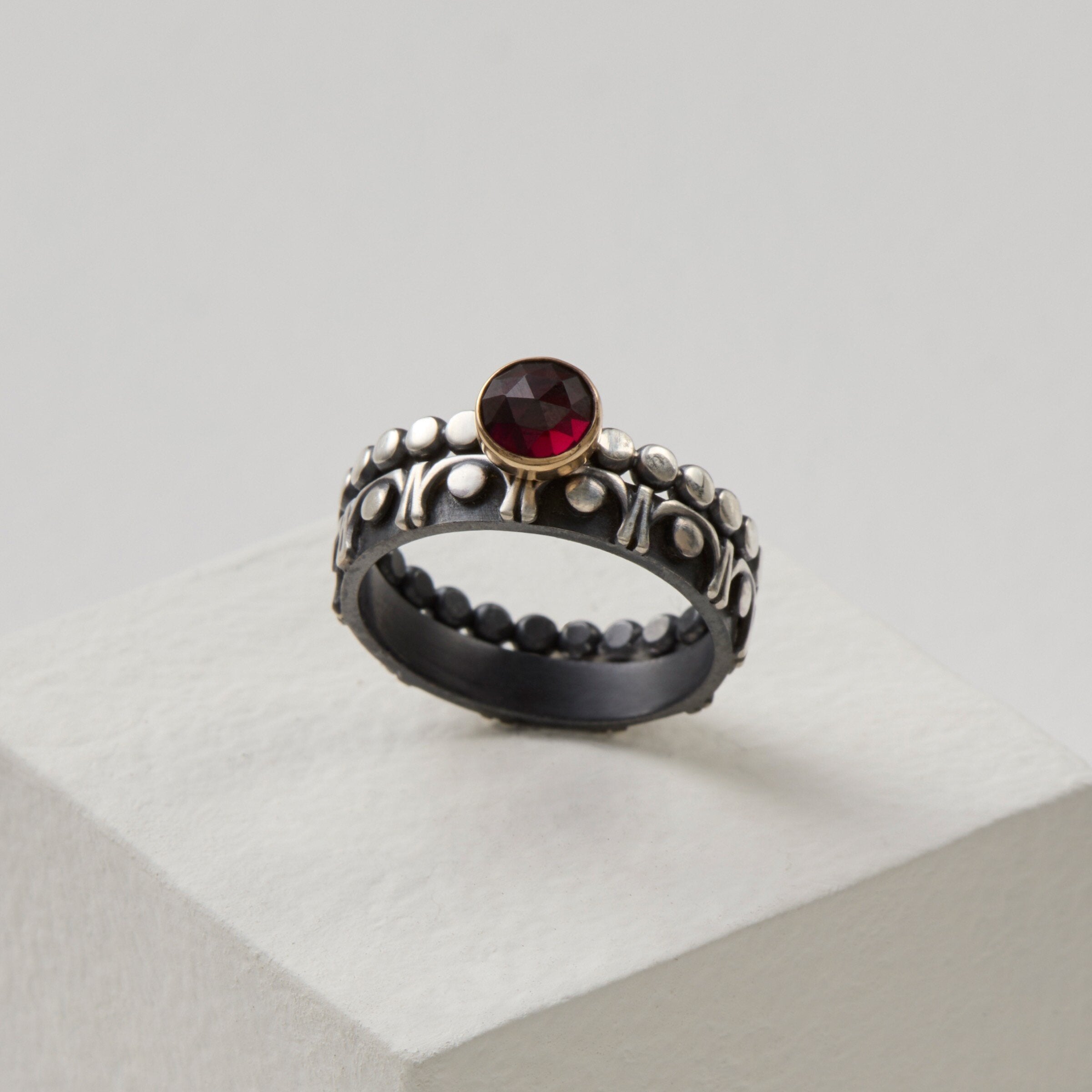 shown with the gemstone solitaire ring in garnet