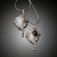 white pearl (left) and black pearl (right) in bright silver